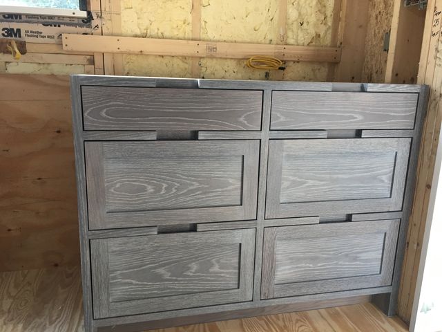 Dark-stained drawer cabinet