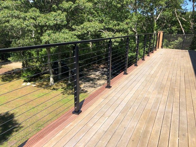 Wood deck with black cable railing