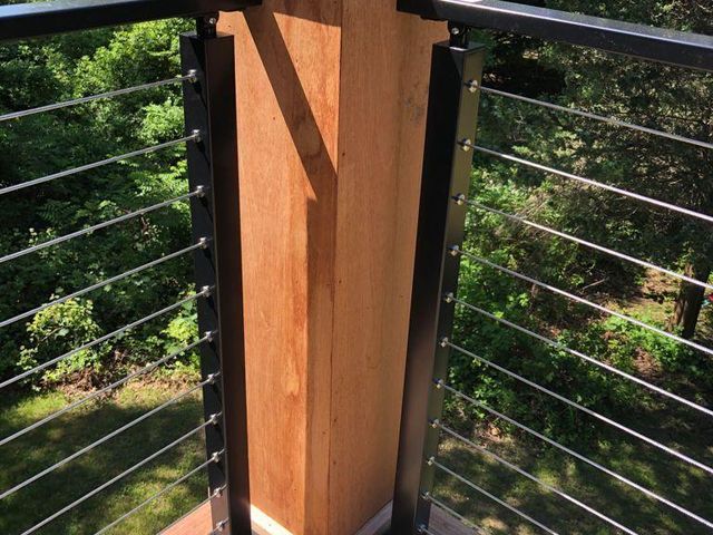 Wood railing post with cable railing