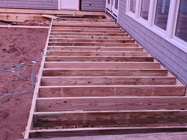 New deck framing with stairs off the house