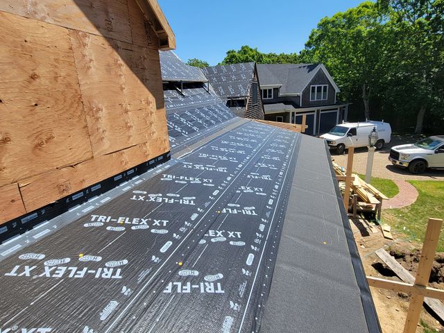 Underlayment on a roof next to a gable