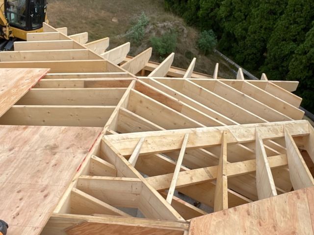Roof rafters with sheathing going on