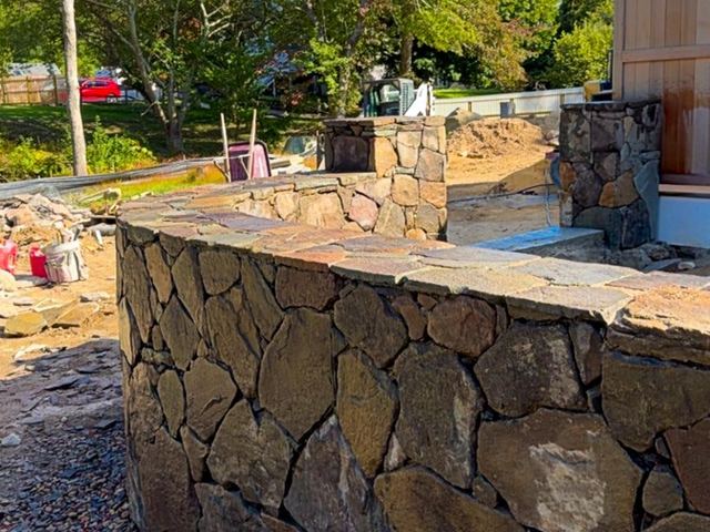 Fieldstone wall with stone piers