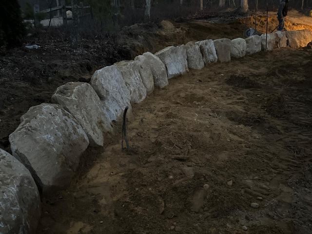 Boulder border along a graded area