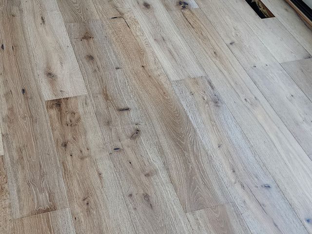 Close-up of the wide-plank oak floors
