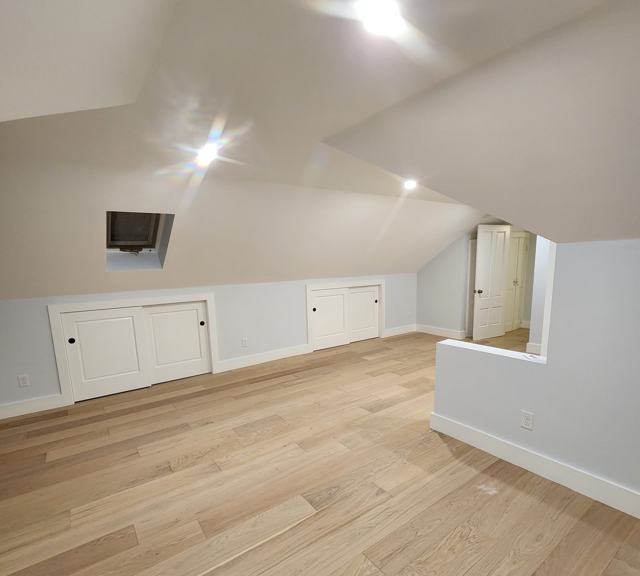 Attic room with knee-wall storage doors