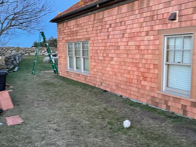 Shingle siding on the side of a house