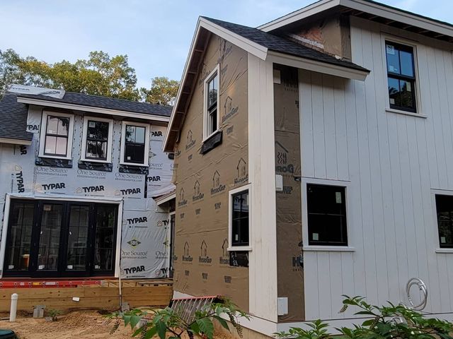House with new siding and trim going on