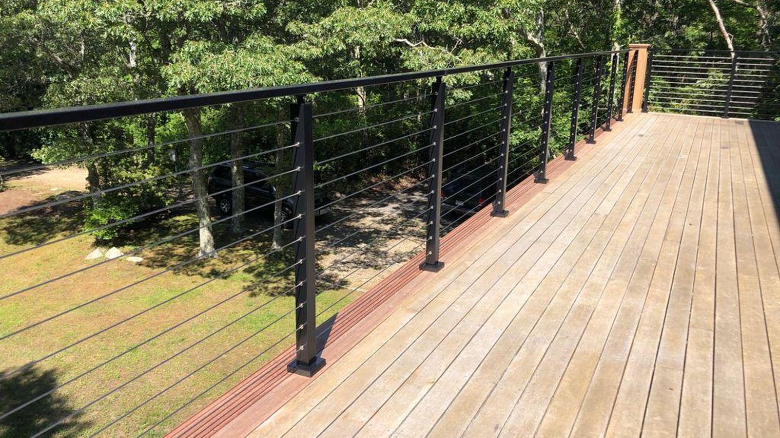 Wood deck with black cable railing